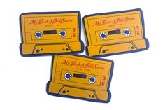 three yellow and blue coasters with an old school cassette design