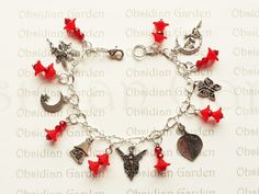 Hand made original fairy glass bead and charm bracelet. Charming silver plated bracelet with 7 Tibetan silver charms (crescent moon fairy, butterfly, etched leaf, winged fairy,  fairy house, starry moon, dancing fairy). Intersected with acrylic red flowers, and 4mm dark red faceted rondelles. One off original design, all our charm bracelets are hand made fresh each time and are slightly different, depending on materials available, so no two are exactly the same. All attached to a silver plated link bracelet. Approx. 19.5cm or 7 3/4 inches long (measurements are approximate, and can be adjusted by closing the clasp on a neighbouring link of the bracelet). Supplied in an organza bag. On dispatch this item will be carefully wrapped in tissue paper before being sent in a padded envelope for ex Moon Dancing, Dancing Fairy, Fairy Butterfly, Red Charm, Moon Fairy, Silver Plated Bracelet, Bead Charm Bracelet, Flower Fairy, Original Bags