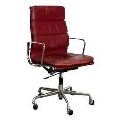 a red leather office chair with chrome frame and casteor wheels on an isolated white background