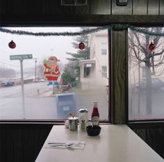 a table with some food on it in front of a window