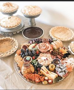 a table topped with pies and other baked goods