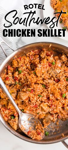 a pan filled with chicken and rice on top of a white table next to silver spoons