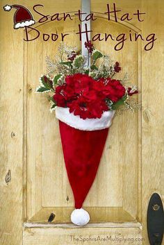 a santa hat door hanger with flowers in it