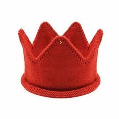 a red knitted crown on a white background