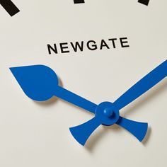 a close up of a clock with the words newgate on it's face