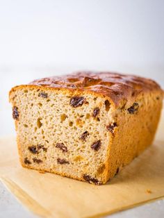 a loaf of bread sitting on top of a wooden cutting board