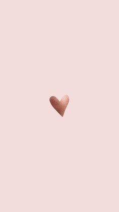 a heart shaped object on a pink background