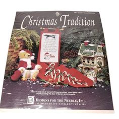 a christmas card with a teddy bear and other decorations on it's front cover