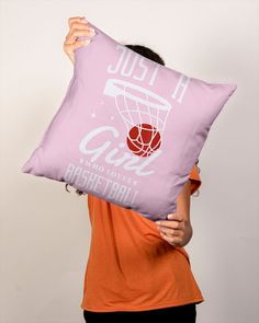 a woman holding up a pillow that has a basketball hoop on it and the words air jordan printed on it