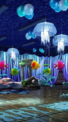 an underwater themed party with balloons and decorations