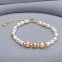 This beautiful Freshwater pearl bracelet ranges between 7-8mm in size and consists of beautiful and lustrous pearls in AAAA+ quality. All pearls in this bracelet are round and are strung with silk thread and double-knotted between each pearl. Known as the 'icon' of cultured pearls, Freshwater pearls have graced the necks, ears, fingers, and wrists of women for decades. Huge Tomato imports their Freshwater pearls from the Freshwater rs of Japan, grown in the Pinctada fucata oyster. All of our Fre Gold Pearl Bracelet, Pearl Bracelet Gold, Cultured Pearl Bracelet, Buy Pearls, Pearl Bracelets, Freshwater Pearl Jewelry, Antique Fashion, Jewelry Mirror, Freshwater Pearl Bracelet