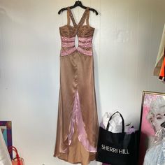 Sherri Hill Brand Size 8 Like New Condition No Retail Sales Tag Does Have Sherri Hill Brand Fabric Tag With Size ( See Pics ) Pink & Caramel Color Tones Tons Of Rhinestones & Exquisite Beadwork Throughout Long Extended Train At Back Back Zip Up Encloser & Upper Back 3 Hook & Eye Enclosures Any Questions Please Feel Free To Ask Fitted Beige Maxi Dress For Prom, Beige Fitted Satin Maxi Dress, Fitted Beige Satin Maxi Dress, Beige Fitted Satin Evening Dress, Beige Fitted Dress With Sweep Train, Fitted Beige Dress With Sweep Train, Beige Fitted Evening Dress For Prom, Fitted Beige Dresses With Sweep Train, Fitted Beige Evening Dress For Prom Season