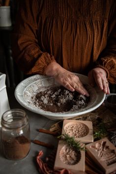 a person is holding a plate with food on it and some cinnamon sticks in front of them