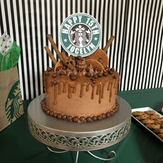 a starbucks cake with chocolate frosting and cookies