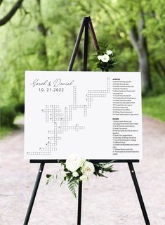 a crossword sign with flowers on it