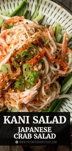 a plate with noodles, vegetables and sauce on it that says kanni salad japanese crab salad