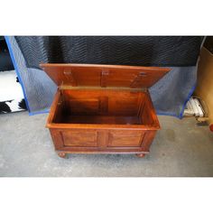 an old wooden chest sitting on the ground