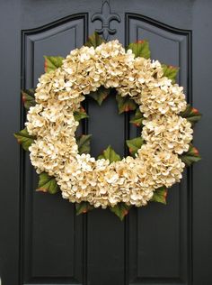 a wreath is hanging on the front door