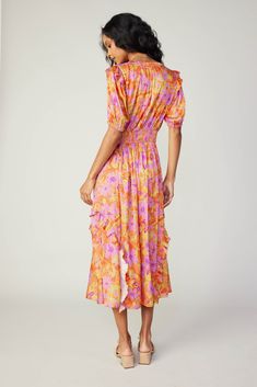 Done in a grand floral print, this midi dress is perfect for sun-drenched strolls through the countryside or your favorite city park. It has daintily detailed ruffles on the shoulders and skirt, plus it's got slightly structured shoulders for a defined shape. •Split neckline •Relaxed fit •Lightly ruffled shoulders •Ruffled skirt DIMENSIONS •Standard: 49" Length Item number 249007650% Polyester 50% Recycled Polyester Hand wash cold Digitally printed Digital Printing minimizes water consumption an Summer Garden Party Midi Dress With Ruffles, Summer Knee-length Floral Dress With Ruffles, Spring Floral Midi Dress With Ruched Detail, Spring Vacation Midi Dress With Ruffled Skirt, Summer Midi Dress With Ruffles For Garden Party, Summer Vacation Midi Dress With Ruffled Skirt, Summer Midi Dress With Ruffled Skirt For Vacation, Knee-length Ruffled Floral Dress For Summer, Knee-length Floral Dress With Ruffles For Summer