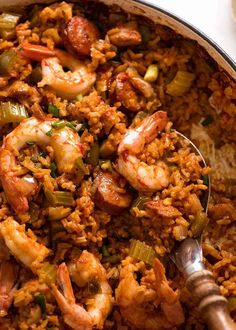 a large pot filled with rice and shrimp