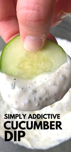 a cucumber dip being held up to the camera with text overlay that reads, simply addictive cucumber dip