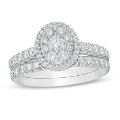 Celebrate every moment with this gorgeous diamond bridal set. Fashioned in 14K white gold, the splendid engagement ring features an oval-shaped diamond composite - centered with a 1/6 ct. round stone - wrapped in a diamond halo. Diamonds shimmer in cupped settings along the shank. On your wedding day, the coordinating diamond-lined band seals your vows. Captivating with 1 ct. t.w. of diamonds and a bright polished shine, this bridal set sparkles from "Yes!" to "I do!" Diamond Frame, Diamond Bridal Sets, Stone Wrapping, Diamond Wedding Band, Bridal Set, Diamond Design, Diamond Halo, Oval Diamond, Lab Created Diamonds