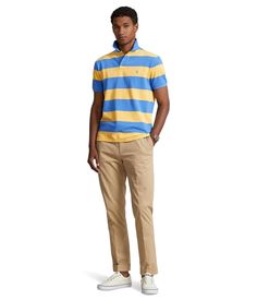 Grab that comfortable and versatile look donning the Polo Ralph Lauren® Classic Fit Striped Mesh Polo Short Sleeve Shirt. It features ribbed collared neckline, cut fuller through the chest waist and sleeves, and embroidered brand logo on the left chest..Classic fit..Short sleeves with ribbed armbands..Two-button placket.Pull-on construction..Allover stripe pattern..High-low hemline with side vents..100% cotton..Machine washable..Imported. Fitted Yellow Polo Shirt For Spring, Fitted Yellow Top With Polo Collar, Striped Fitted Cotton Polo Shirt, Fitted Striped Cotton Polo Shirt, Yellow Spring Top With Ribbed Collar, Ralph Lauren Polo Collar Tops For Spring, Ralph Lauren Spring Polo Collar Top, Casual Yellow Tops With Collared Neckline, Fitted Striped Polo Shirt With Ribbed Collar