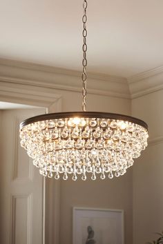 a chandelier hanging from the ceiling in a room