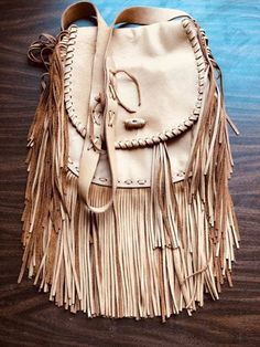 Fringe has always made a big fashion statement and the 70's vibe is back. If you like a fashion throwback look, this beautiful fringe bag is perfect for you. One touch of this soft, supple bag and you will want to add it to your handbag collection. This bag features plenty of storage with one front pocket, two interior pockets, and an adjustable shoulder strap. Cheap Bohemian Fringe Bags, Cheap Chic Fringe Bags, Daily Use Fringe Bags, Cheap Travel Bag With Fringe, Cheap Travel Bags With Fringe, Chic Affordable Fringe Bags, Luxury Chic Bags With Fringe, Luxury Fringe Bags For Shopping, Cheap Casual Fringe Shoulder Bag