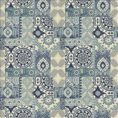 a blue and white patchwork rug