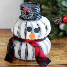 a snowman made out of toilet paper on top of a table