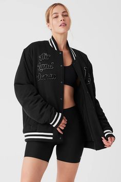 G.O.A.T Jacket - Black | Alo Yoga Black Letter Embroidered Outerwear For Streetwear, Black Outerwear With Letter Embroidery For Fall, Black Fall Outerwear With Letter Embroidery, Fall Black Outerwear With Letter Embroidery, Black Letter Embroidery Outerwear For Fall, Sporty Black Outerwear With Letter Patch, Black Varsity Jacket With Letter Patch, Black Outerwear With Letter Patch For Streetwear, Urban Outerwear With Embroidered Patch For College