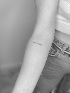 a woman's arm with the word my way written on it in cursive font