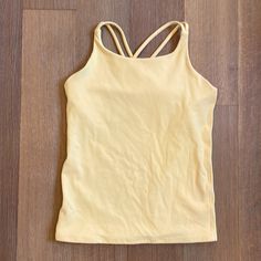 Brand New W/O Tag Pretty Yellow Pale Stretch Racerback Tops For Sports, Athleisure Tank T-shirt For Sports, Yellow Sports Tank Top, Yellow Fitted Tank Top For Sports, Medium Support Racerback Top For Sportswear, Medium Support Racerback Sportswear Top, Yellow Sleeveless Gym Tops, Medium Support Racerback Sports Top, Sporty Snug Fit Summer Top