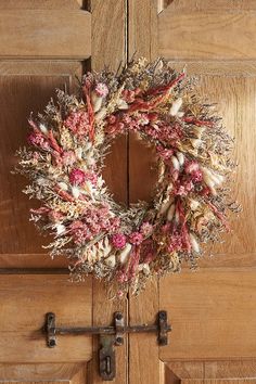 a dried wreath hangs on the front door