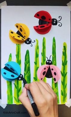 the ladybugs are painted on paper with crayons and markers to make them look like they're ready for spring