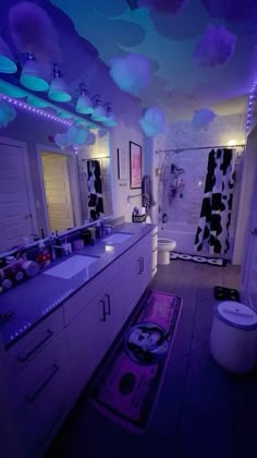 the bathroom is decorated in purple and black