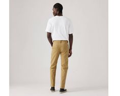 Levi's® XX Chino;don't call them khakis. They're softer, with just the right amount of stretch. Slightly roomier than our Slim Taper, our XX Chino Standard Taper Pants have a little more give but look just as clean and contemporary. A modern take on the classic chino Made with supersoft fabric Versatile fit that tapers down to the ankle Woven with a hint of stretch for all-day comfort and easy movement Features a hidden zip-secure pouch in the right pocket This garment feels as good as it looks, thanks to a soft, brushed interior that'll keep you warm and comfy For our vintage lovers: We garment-dyed this piece to give it that lived-in look and broken-in feel Levi's Straight Fit Cotton Bottoms, Levi's Straight Casual Pants, Casual Straight Levi's Pants, Taper Pants, White Levis, Vintage Lovers, Tapered Pants, Vintage Lover, Men's Pants