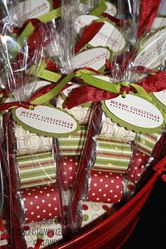 many wrapped presents in plastic bags with ribbons