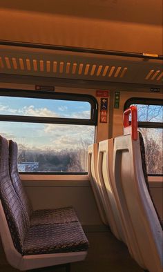 the seats are empty on the train and there is no one in them or they can be seen through the window