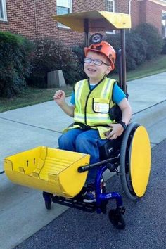 a boy in a wheel chair on the street