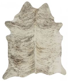 a white and brown cowhide rug on a white background