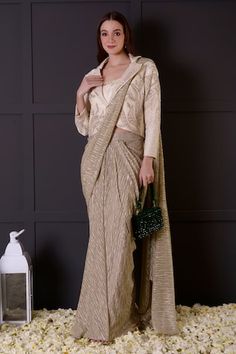 Gold pre-draped saree in imported shimmer base. Comes with an ivory bamberg silk blouse with leaf and pearls hand embroidered neckline and a jacket. - Aza Fashions Pre-draped Georgette Saree With Zari Work, Elegant Pre-draped Saree With Zari Work, Designer Pre-draped Saree With Cape Sleeves For Eid, Festive Pre-draped Georgette Saree, Elegant Festive Pre-draped Saree In Traditional Drape, Elegant Zari Work Pre-draped Saree For Eid, Pre-draped Saree With Cutdana And Cape Sleeves, Bollywood Style Pre-draped Saree In Raw Silk, Elegant Semi-stitched Traditional Drape Pre-draped Saree