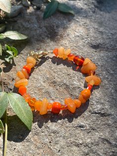 Bright and beautiful orange beaded bracelet with semiprecious gemstone, glass and crystal beads. Luxury Orange Gemstone Beads Jewelry, Cheap Orange Beaded Bracelets For Beach, Amber Carnelian Round Beaded Bracelets, Amber Carnelian Bracelets With Round Beads, Amber Carnelian Beaded Bracelets With Round Beads, Orange Carnelian Bracelets With Natural Stones, Adjustable Orange Gemstone Bead Bracelet, Orange Bohemian Beaded Bracelets With Faceted Beads, Bohemian Carnelian Bracelet In Orange