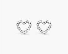 14K White Gold Open Diamond Heart Earrings. These open diamond heart studs are a contemporary take on a classic look. Set in 14K white gold, they perfect for everyday wear. Classic Heart-shaped White Gold Diamond Earrings, White Heart Shaped Diamond Earrings Fine Jewelry, Classic Heart-shaped Brilliant Cut Earrings, Classic Brilliant Cut Heart Earrings, White Heart-shaped Diamond Earrings, Classic White Heart Earrings With Brilliant Cut, Formal White Gold Heart Earrings With Diamond Accents, Classic White Brilliant Cut Heart Earrings, Elegant White Gold Open Heart Earrings