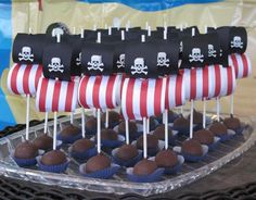 pirate cupcakes are arranged on top of each other in front of an american flag