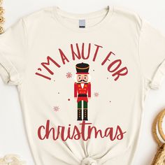 This Nutcracker shirt makes a totally unique Christmas gift for any Nutcracker ballet fan or a delightful and humorous holiday-themed shirt to wear during the Christmas season! Grab this tee today while it's on sale! Delivery Times: ◦ Production: 1 business day (avg.) ◦ Shipping: 3 business days (avg.) Unisex Fit: ◦ Extra soft, preshrunk unisex t-shirt ◦ Women: Semi-fitted, laidback, rollable, & tuckable ◦ Men: Fitted on upper body & loose around the belly ☞ Size up for a looser fit Soft Materia Nutcracker Christmas Shirt, Funny Nutcracker, Nutcracker Shirt, Future Board, Nutcracker Christmas Decorations, Funny Holiday Shirts, Cute Christmas Shirts, Womens Christmas Shirts, Unique Christmas Gift