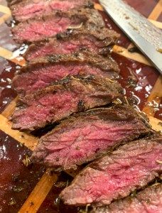 steak steak marinade on a cutting board with a knife next to it and text overlay that reads, italian steak steak marinade