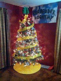 a christmas tree decorated with ribbons and lights