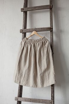 Below the knee skirt is made from 100% soft and washed linen. This Petticoat is perfect for wearing under dress or other skirt or can be worn alone. Match it with our tunics! Details: - Composition: 100% Oeko-Tex certified linen - Colour: natural - Elastic waist - Pockets - Size: One size/fits all - Medium weight linen - Linen care: machine wash gentle; tumble dry low, ironing optional - The price is for one skirt, other pictured items are not included Spring Linen Skirted Bottoms, Linen Pleated Skirted Bottoms, Linen Pleated Skirt Bottoms, Spring Linen Beige Skirt, Relaxed Linen Skirt With Elastic Waistband, Linen Midi Skirt With Elastic Waistband, Beige Linen Flared Skirt, Linen Skirted Bottoms With Pockets, Linen Mini Skirt For Summer